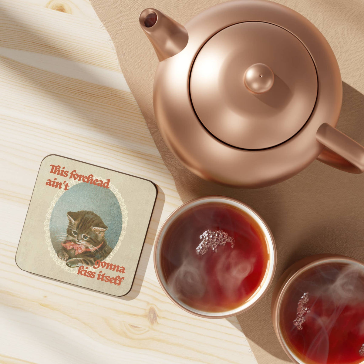 Forehead Kiss kitten coaster shown at an angle, displaying the coaster's gloss MDF finish and rounded edges
