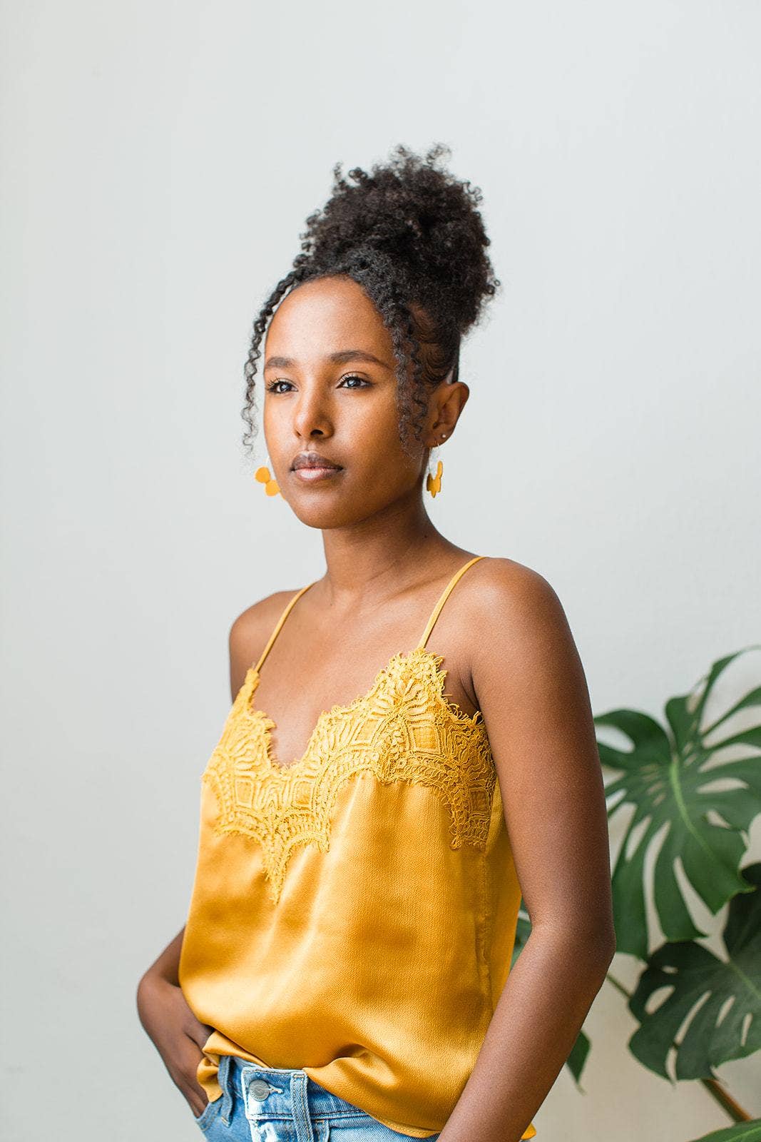 Mustard yellow leather petal hoop earrings on Whitebirch earring card