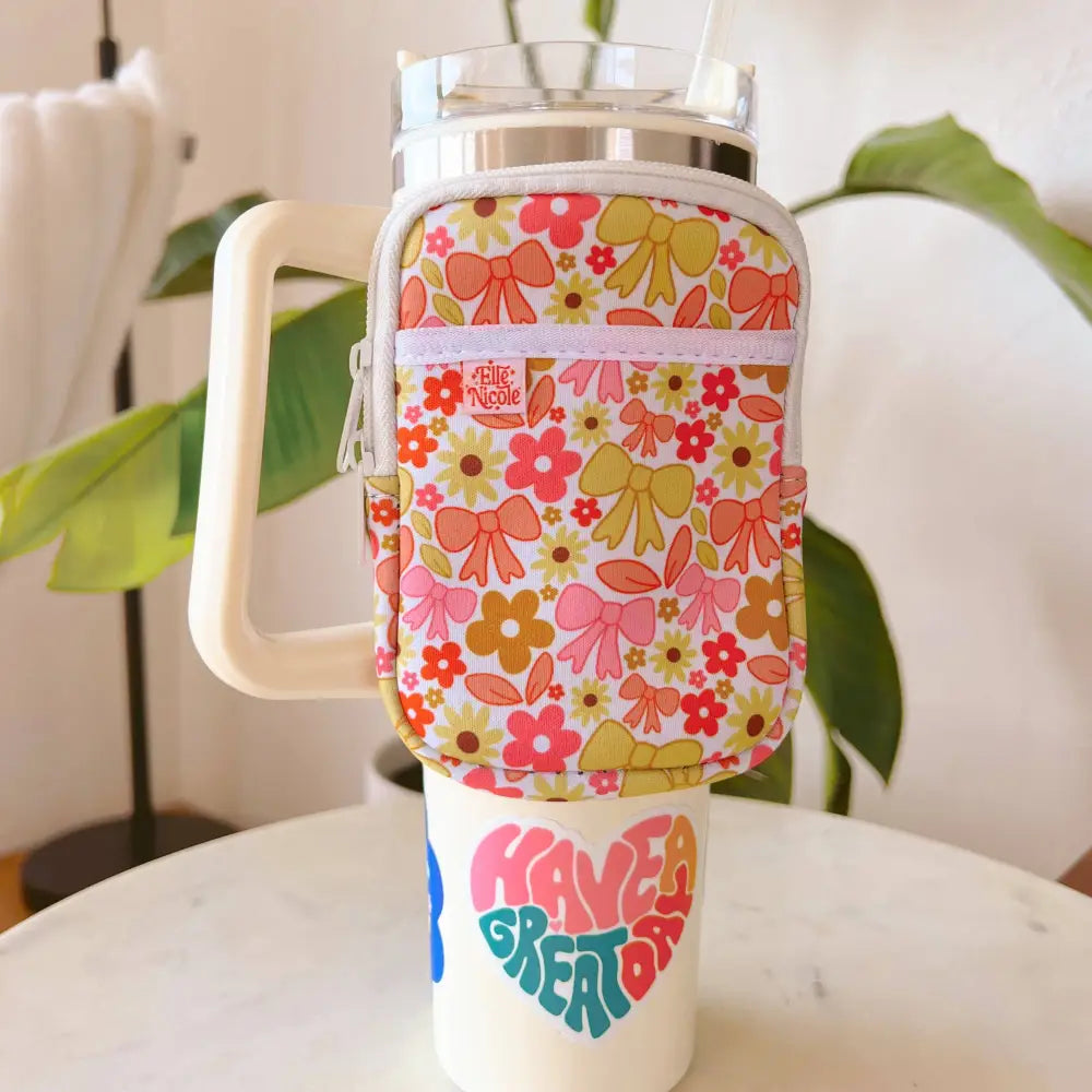 Neoprene water bottle backpack with fall floral and bow print in pink, red, and green – attached to large handled tumbler - PABOOM