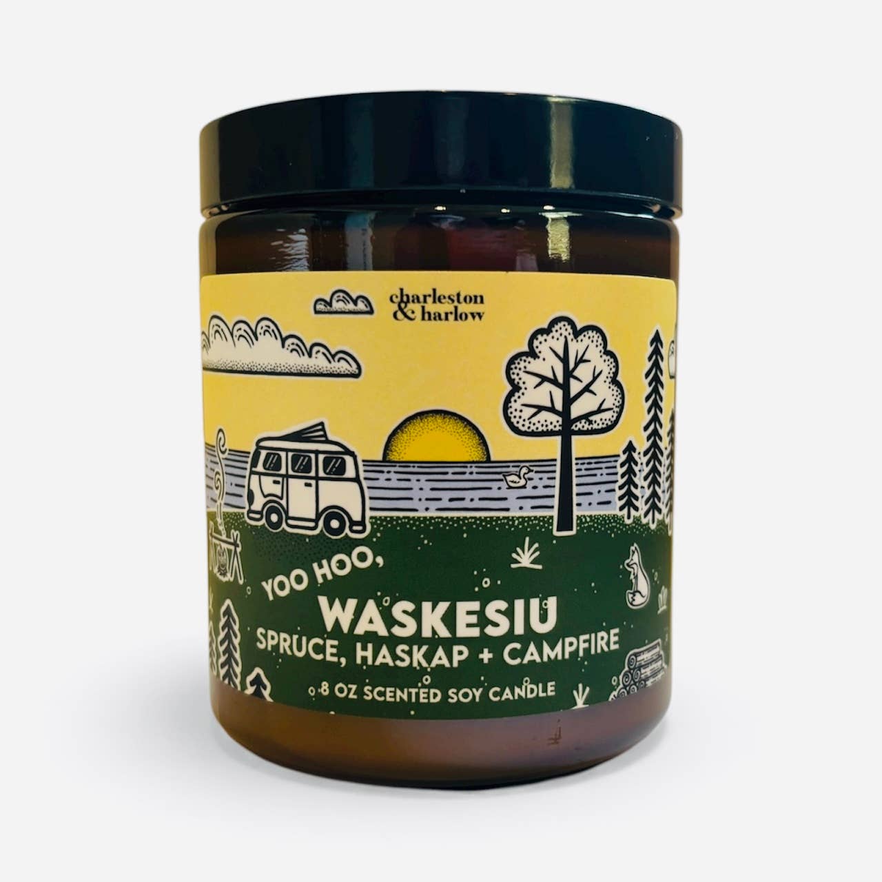 Charleston & Harlow Waskesiu soy candle in amber glass jar with yellow and green label featuring a campervan and lake illustration