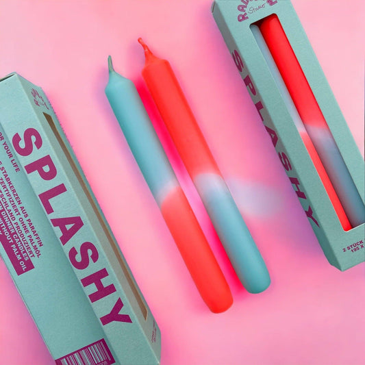 Rainbow Studio Dinner Candle Set Splashy — two dip-dyed taper candles in mint-blue and coral-red gradients, shown with sage green packaging