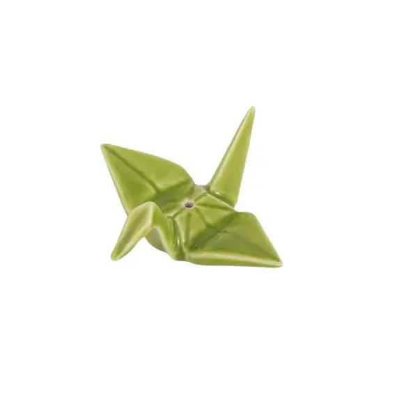 Glossy green ceramic incense holder shaped like a folded origami crane with a small hole for an incense stick