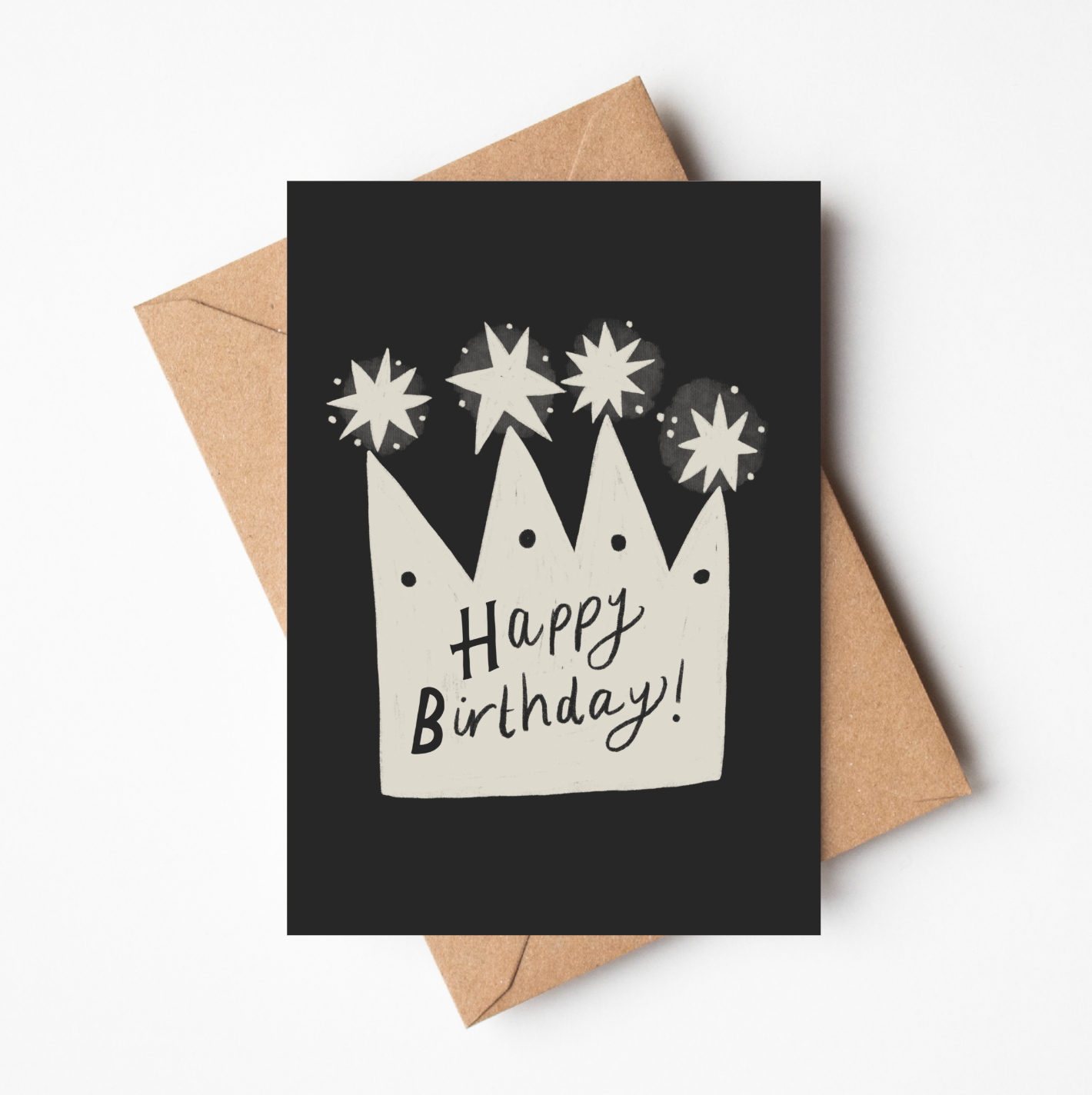 'Happy Birthday Crown' card featuring a hand-illustrated cream crown with stars and 'Happy Birthday!' lettering on a black background