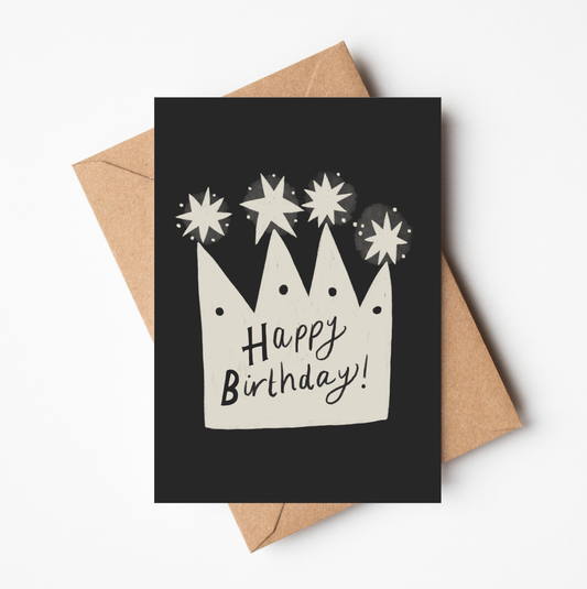 'Happy Birthday Crown' card featuring a hand-illustrated cream crown with stars and 'Happy Birthday!' lettering on a black background