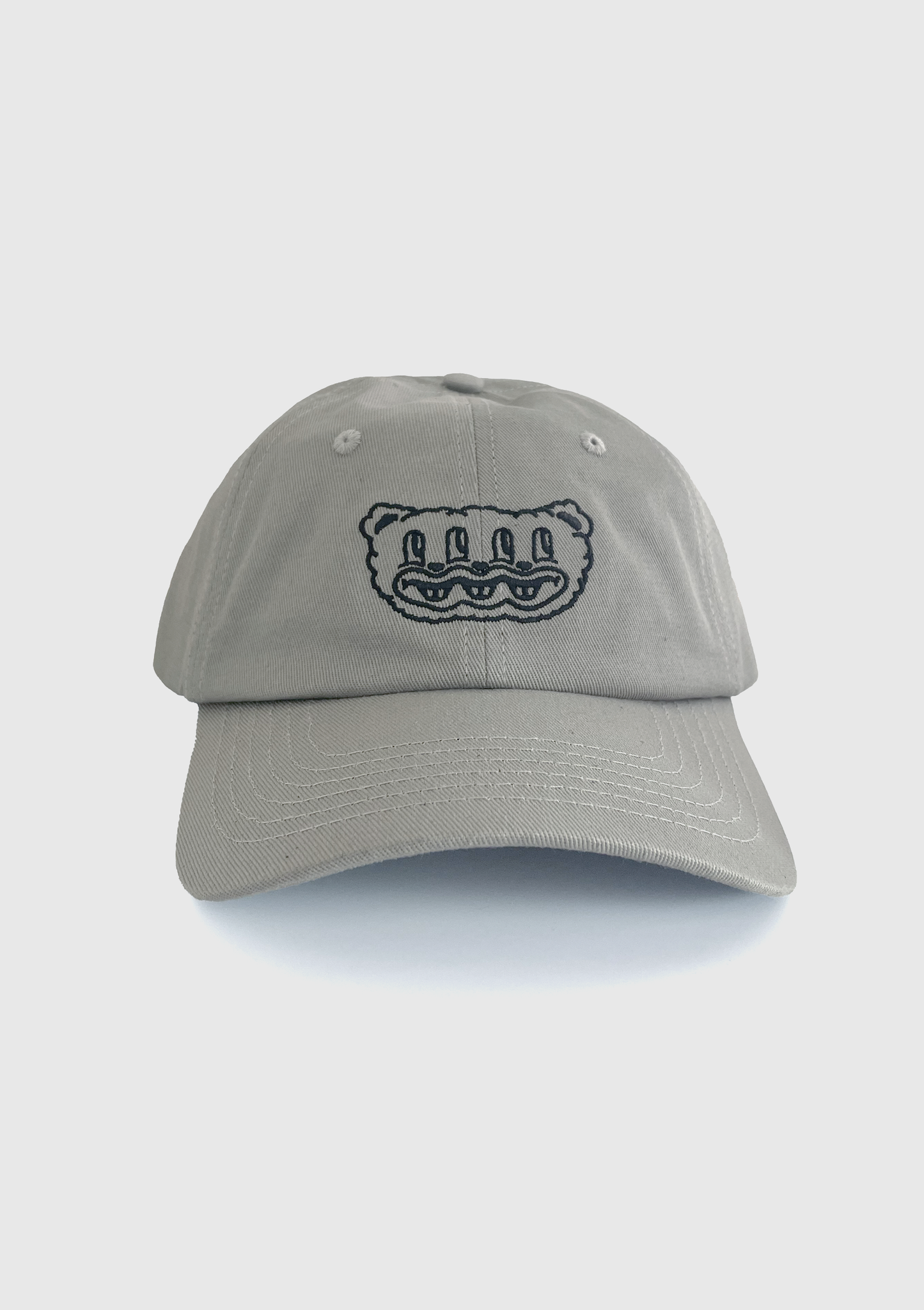 Grey dad hat with embroidered multi-eyed furry creature design on the front panel - PABOOM