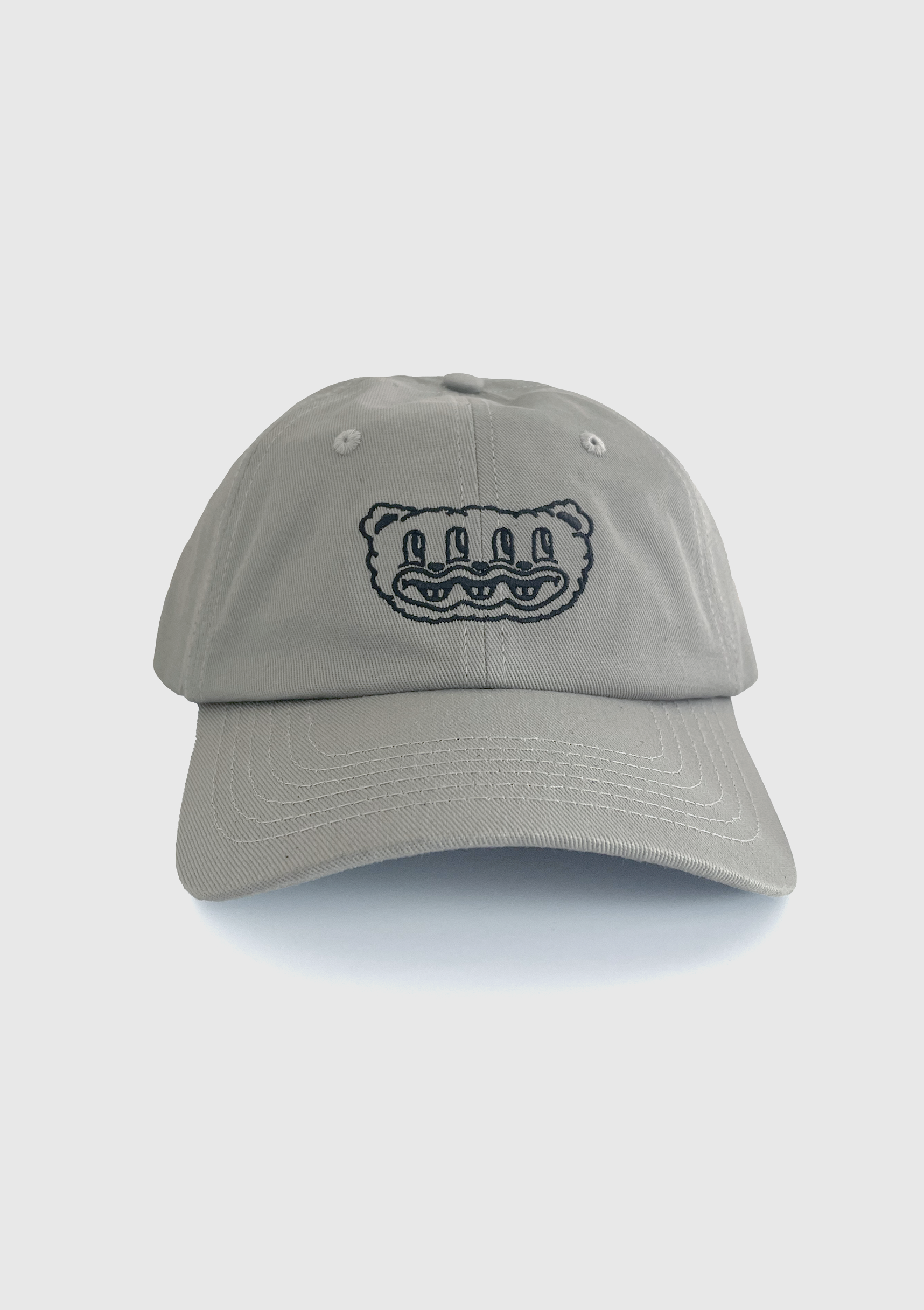 Grey dad hat with embroidered multi-eyed furry creature design on the front panel - PABOOM