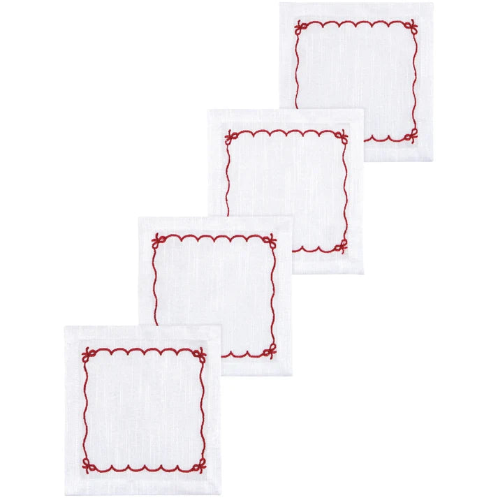 Four white cotton cocktail napkins with a red scalloped and bow-tied embroidered border – PABOOM