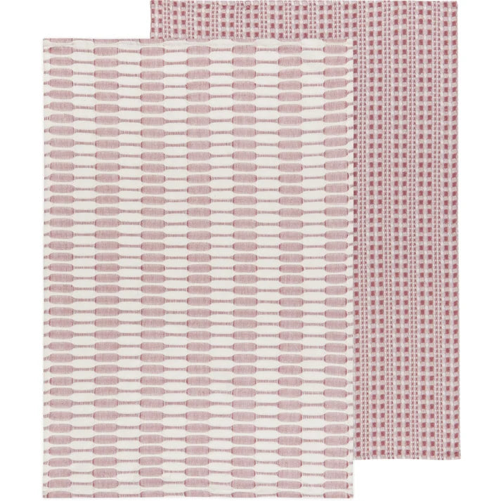 Two folded dusty pink textured cotton dishtowels layered together showing subtle woven patterns – PABOOM
