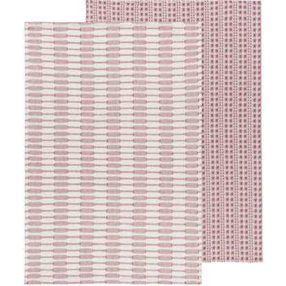 Two folded dusty pink textured cotton dishtowels layered together showing subtle woven patterns – PABOOM
