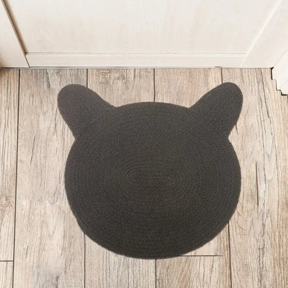 braided cotton cat head shape mat, black, on floor