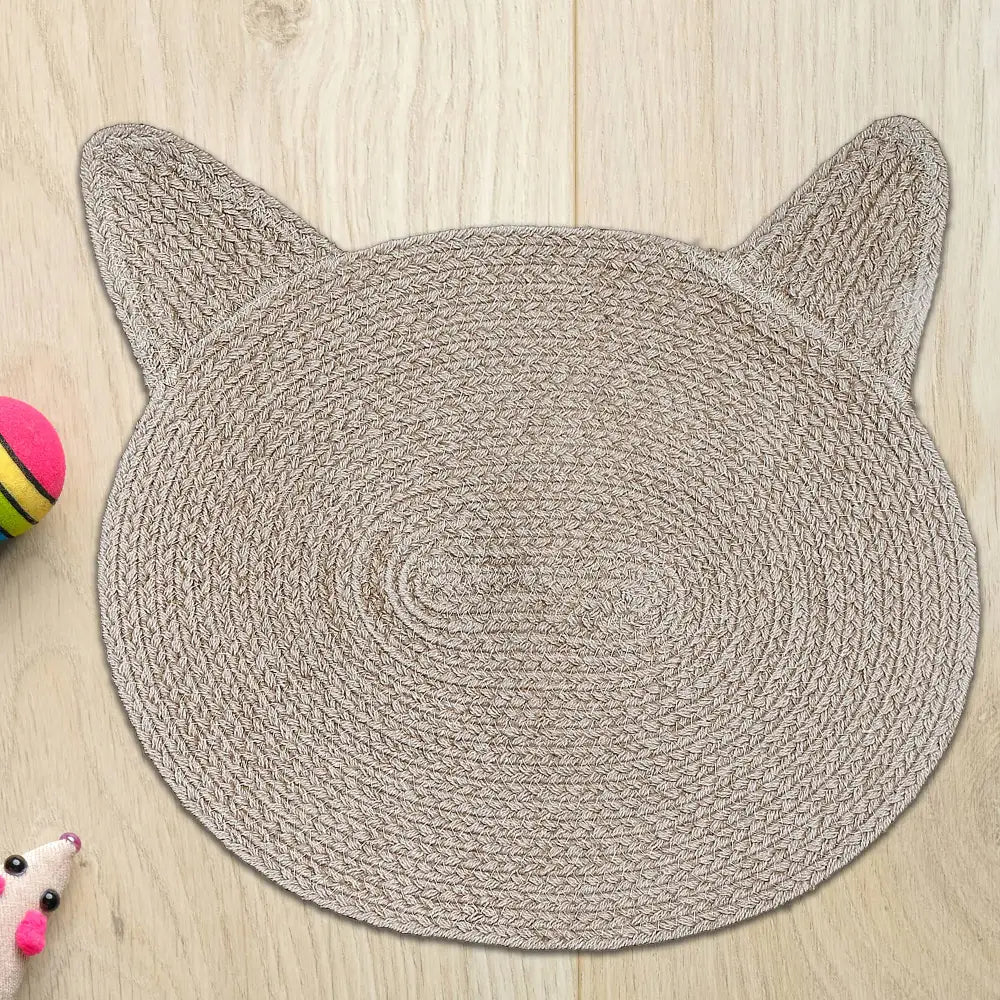 braided cotton cat head shape mat on floor, taupe
