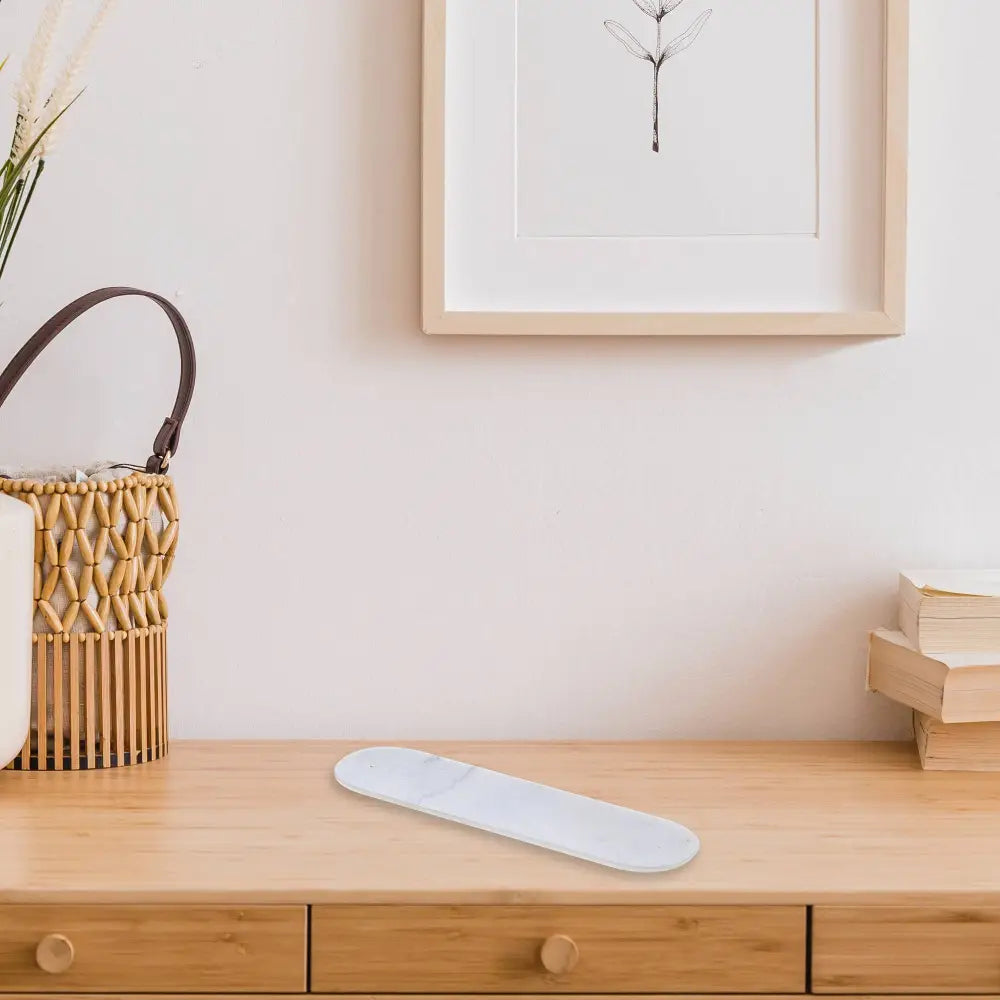 long white marble incense holder on top of cabinet