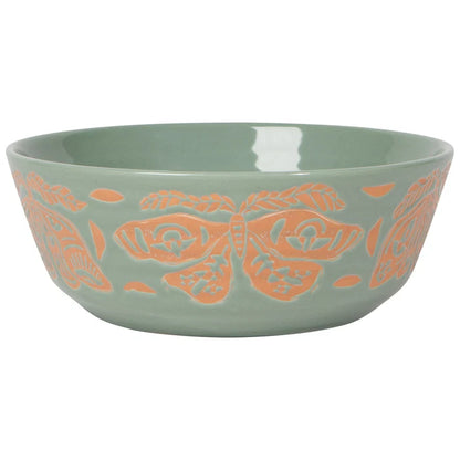 Sage green stoneware bowl with a coral wax-resist moth pattern imprinted around the exterior – PABOOM