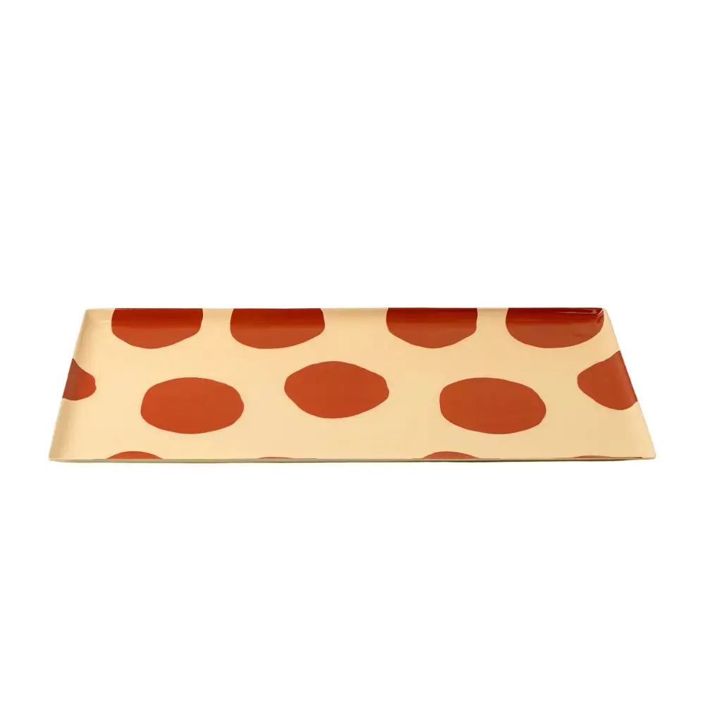 Rectangular envelope with red polka dot pattern on a beige background