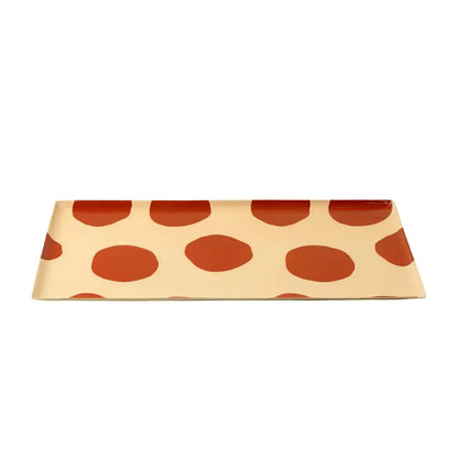 Rectangular envelope with red polka dot pattern on a beige background
