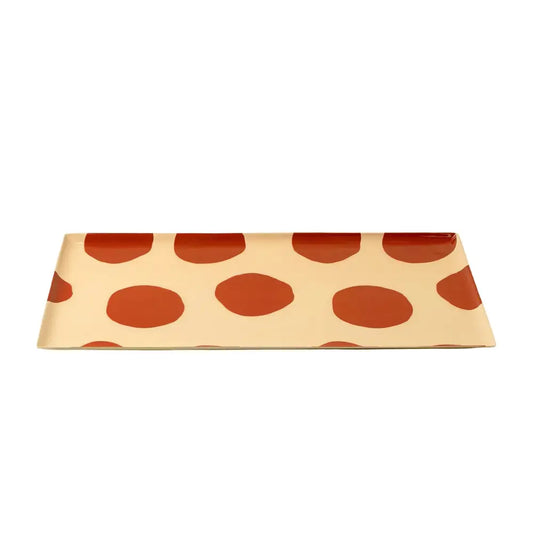 Rectangular envelope with red polka dot pattern on a beige background