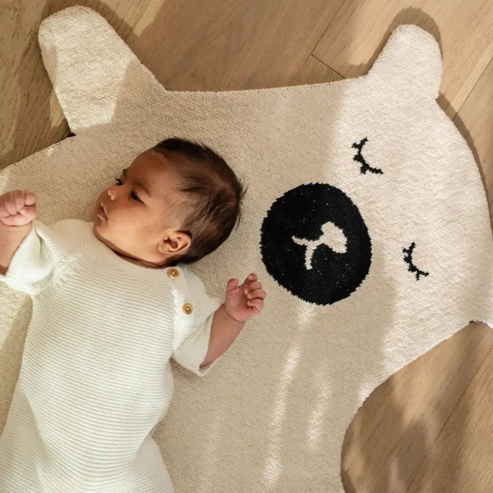 Sleeping bear rug with baby laying on top - PABOOM