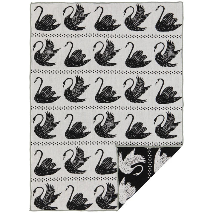 Black-and-white cotton dishtowel with a repeating swan pattern folded to show a black reverse panel – PABOOM
