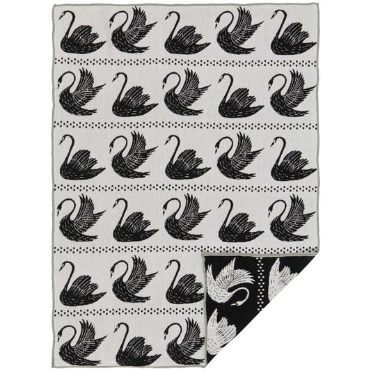 Black-and-white cotton dishtowel with a repeating swan pattern folded to show a black reverse panel – PABOOM