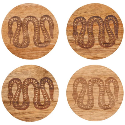Four round acacia wood coasters laser-engraved with a coiled snake medallion design - PABOOM