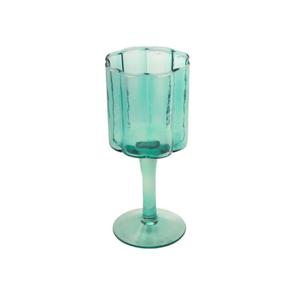 A scalloped sided wine glass that resembles a daisy. Blue, glass. - PABOOM