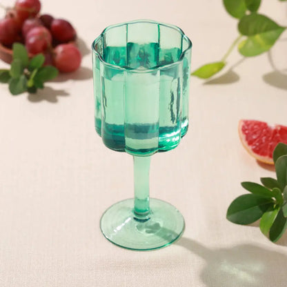 Scallop side wine glass with water in it, blue, glass - PABOOM
