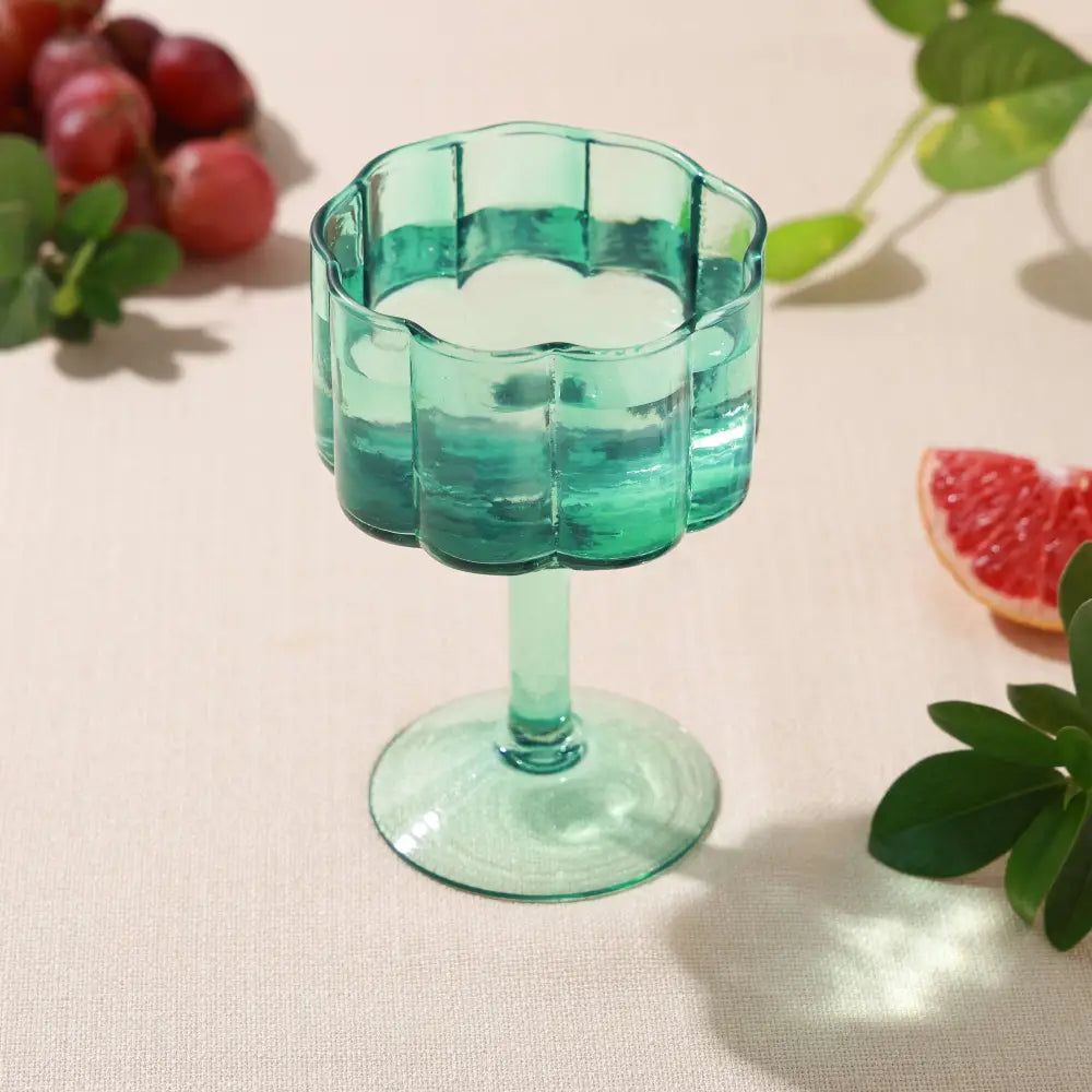 Daisy scallop wine glass with water in it, blue, glass - PABOOM