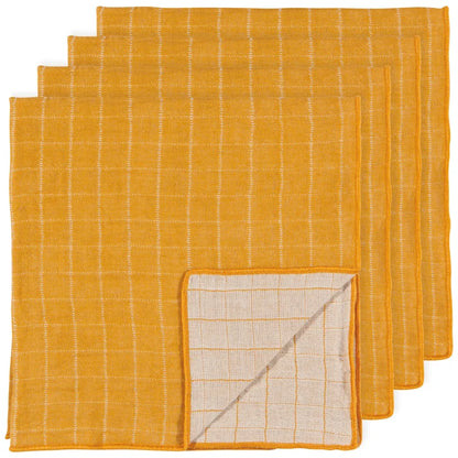 Stack of folded golden ochre cotton napkins with a plush double-weave texture – PABOOM