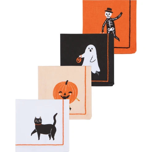 Four Halloween cocktail napkins embroidered with a black cat, jack-o'-lantern, ghost, and skeleton, each framed in contrast stitching - PABOOM