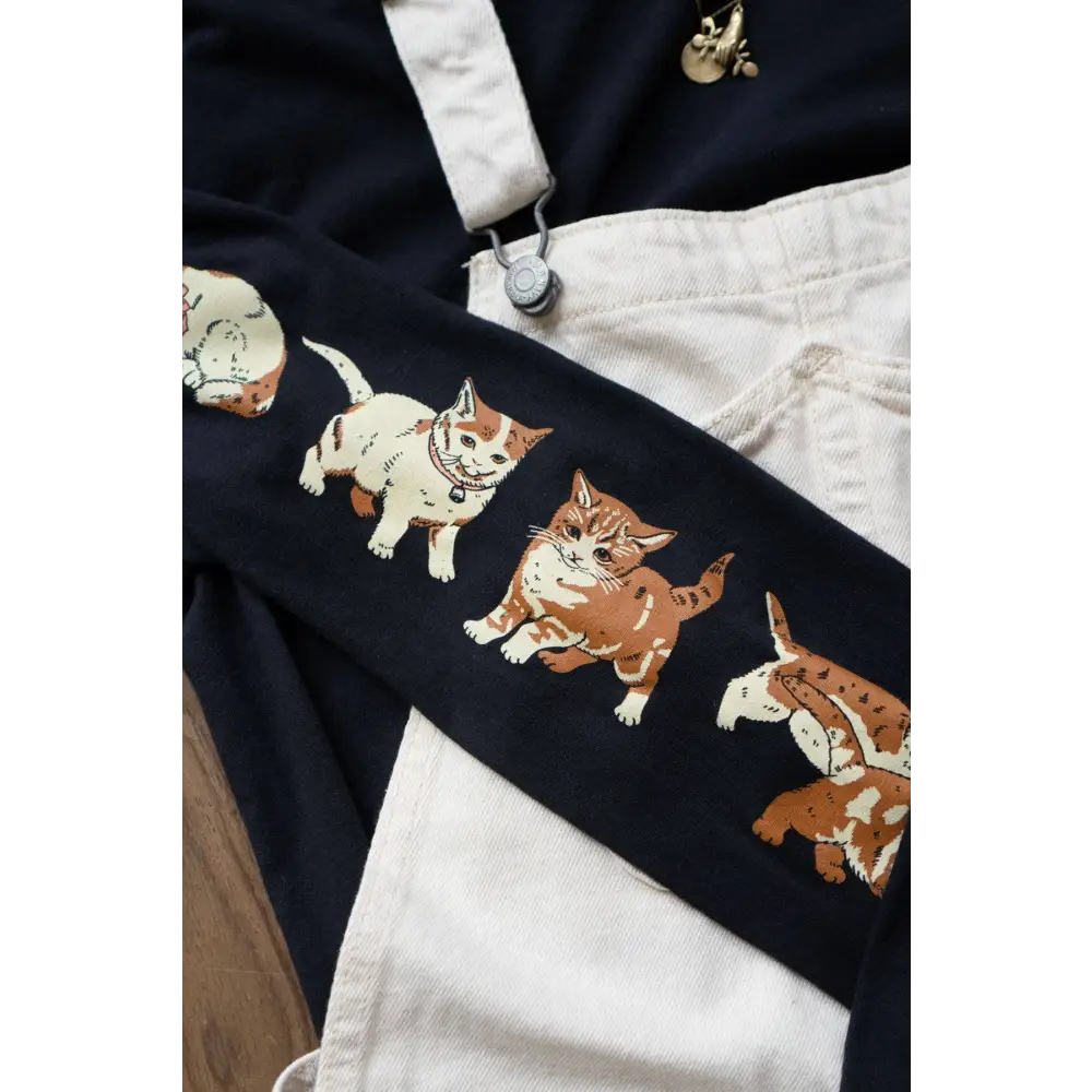 Black Cotton Long Sleeve t-shirt with images of kittens down each sleeve. Cotton, black. Detail of sleeve - PABOOM