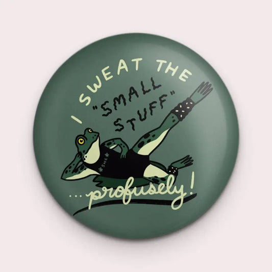 Round green magnet with a logo of a frog doing aerobics and text “I SWEAT THE SMALL STUFF … profusely” by Stay Home Club - PABOOM