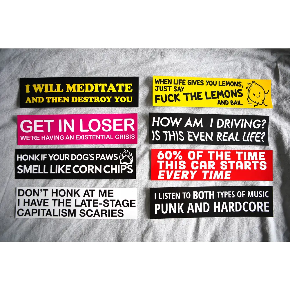 An assortment of Stuntin Goods' bumper stickers