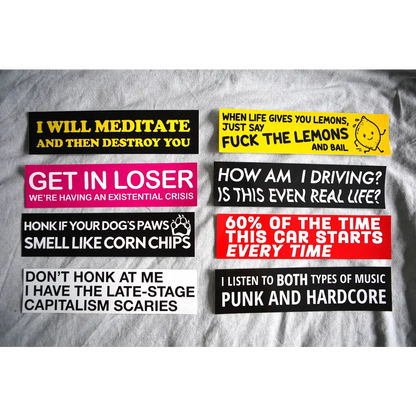 An assortment of Stuntin Goods' bumper stickers