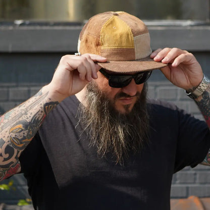 Patchwork corduroy Stuntin Goods cap worn on person’s head - PABOOM