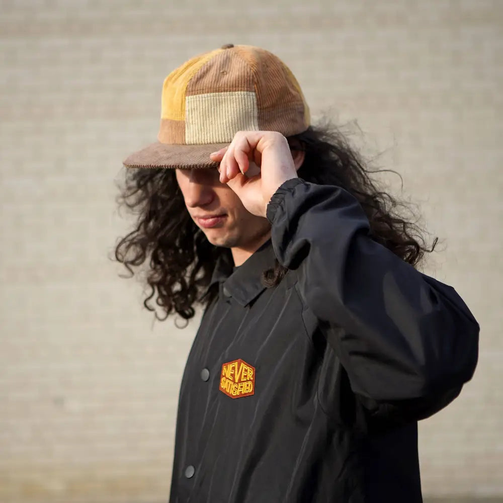 Patchwork corduroy Stuntin Goods cap worn on person’s head - PABOOM