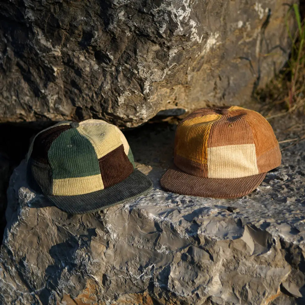 Patchwork corduroy Stuntin Goods hats on rocks
