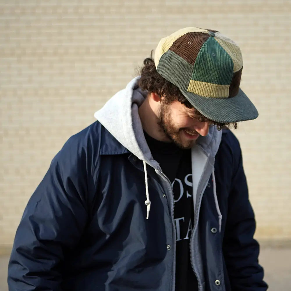 Patchwork corduroy Stuntin Goods cap worn on person’s head - PABOOM
