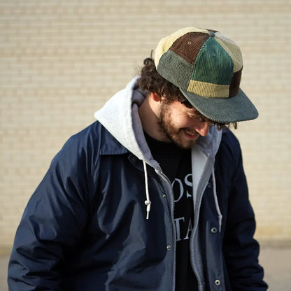 Patchwork corduroy Stuntin Goods cap worn on person’s head - PABOOM