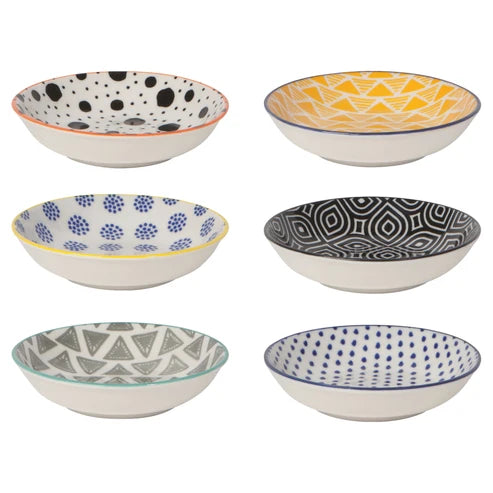 Six small porcelain pinch bowls in mismatched patterns including dots, triangles, and geometric prints in yellow, blue, black, and green - PABOOM