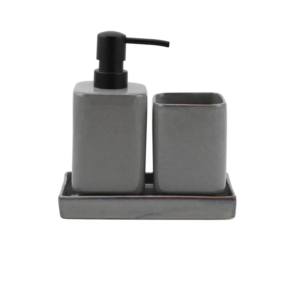 Gray ceramic bathroom set with pump dispenser and cup on a white background