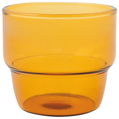 Single amber-toned stackable glass tumbler shown empty on a white background - PABOOM