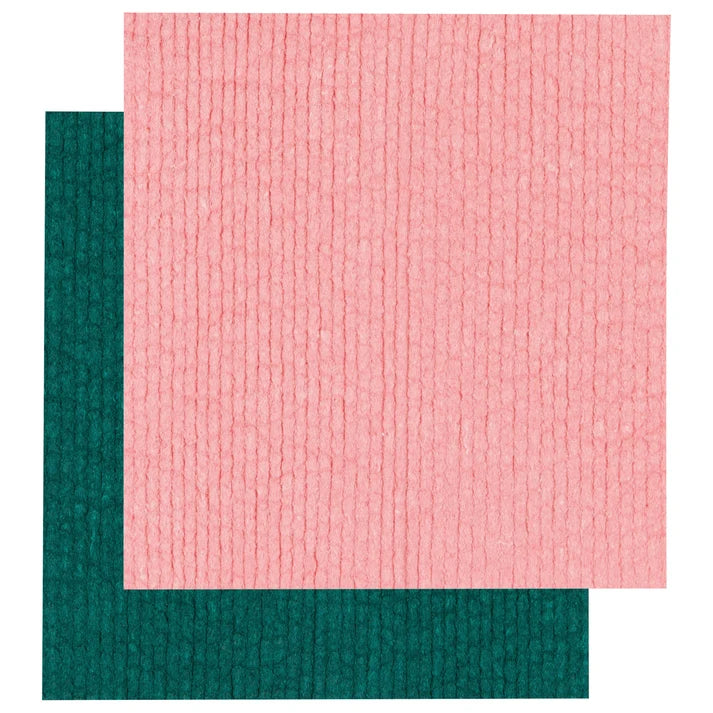 Two solid-colour Swedish dishcloths in evergreen and pink layered on top of each other – PABOOM