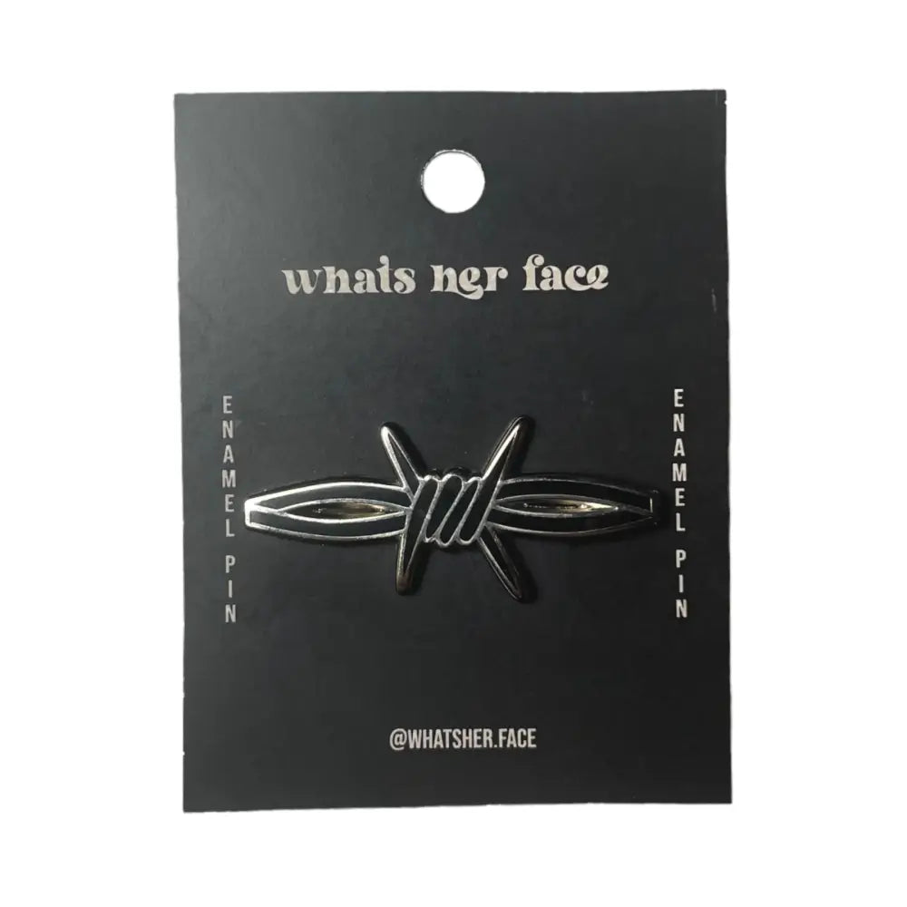 A secton of barb wire shaped enamel black lapel pin