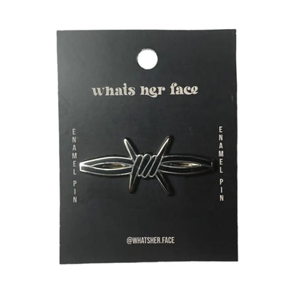 A secton of barb wire shaped enamel black lapel pin