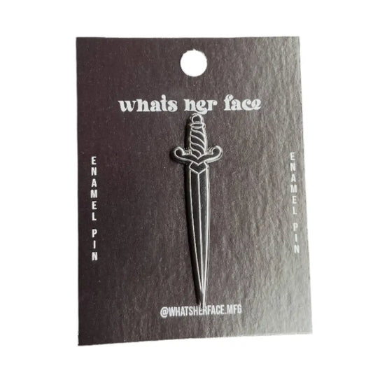 enamel pin of dagger on cardstock package