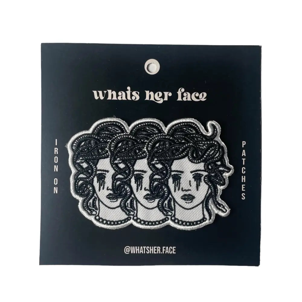 Iron on embroidered patch of three medusa heads with blacked out crying eyes. on black cardstock | PABOOM