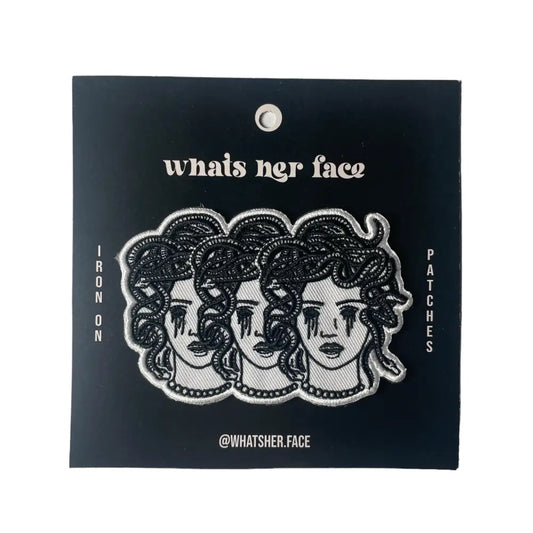 Iron on embroidered patch of three medusa heads with blacked out crying eyes. on black cardstock | PABOOM