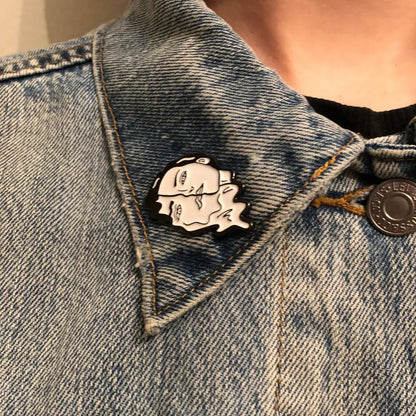 Melting Face Girl Black White Enamel Pin on jacket collar