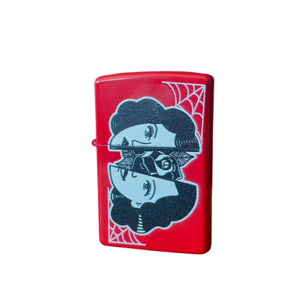Zippo red lighter with a woman’s face splint in half with rose in middle