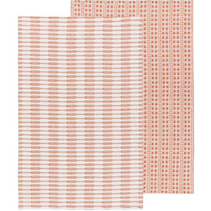 Two folded warm rust-orange textured cotton dishtowels layered together – PABOOM